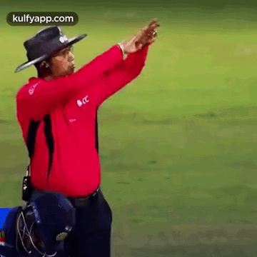Umpire is moving their hands to create a square shape